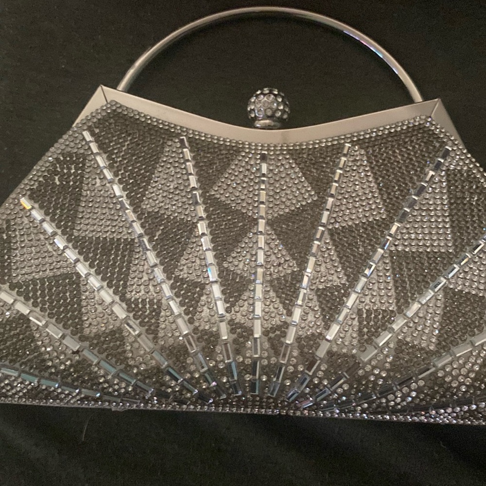 A silver clutch bag